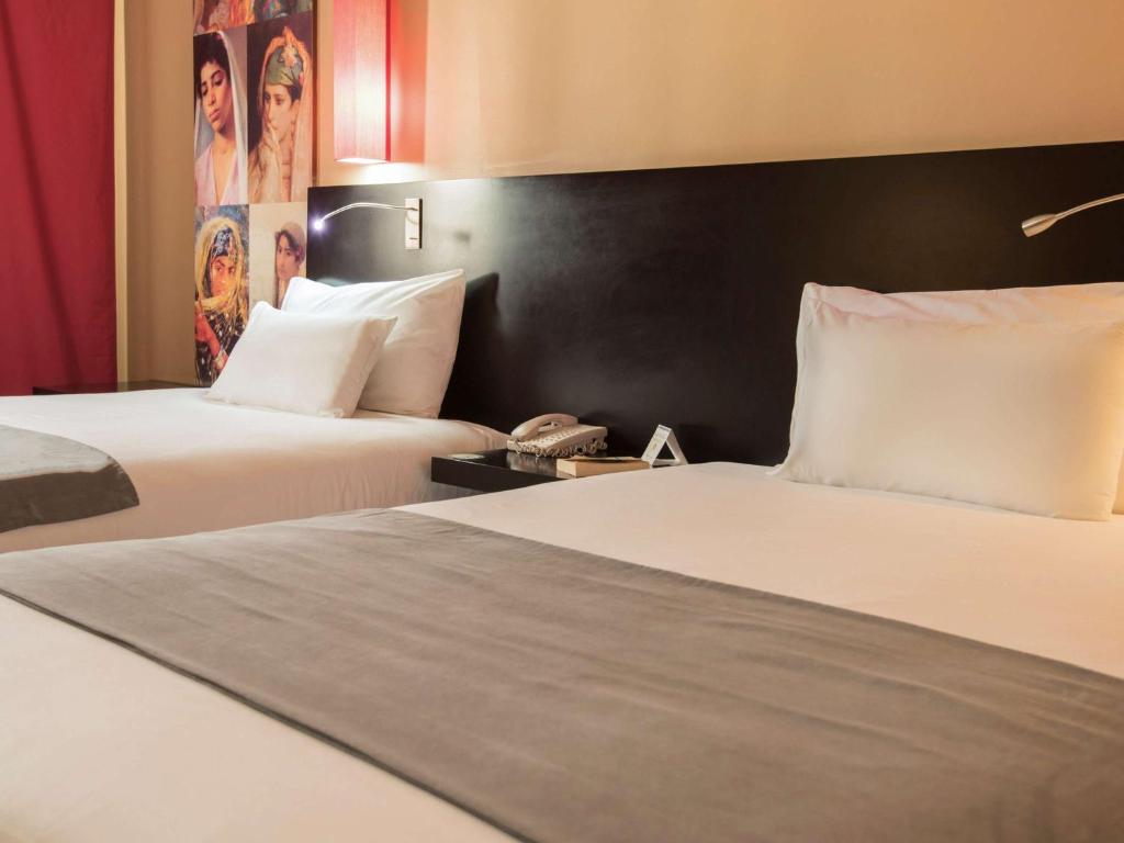Cama o camas de una habitación en Hotel Mercure Alger Aéroport