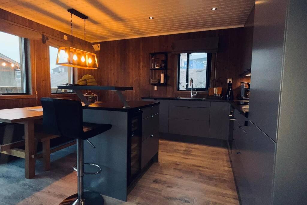 a large kitchen with a table and a counter top at Cabin in Trysil Mountain Arena in Trysil