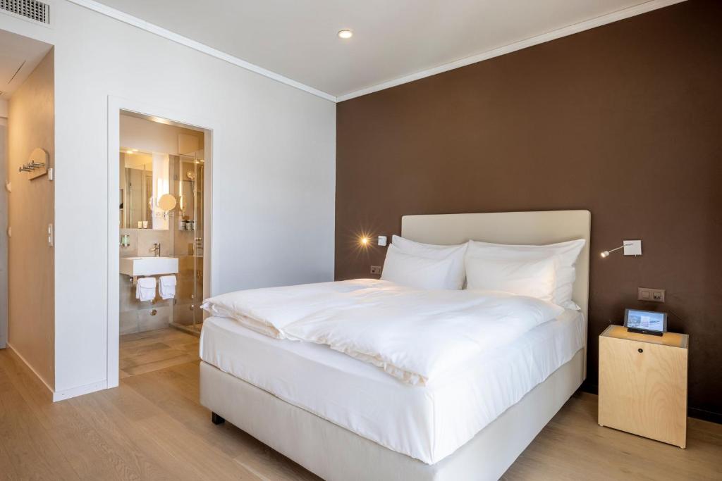 Letto o letti in una camera di Belvedere Swiss Quality Hotel