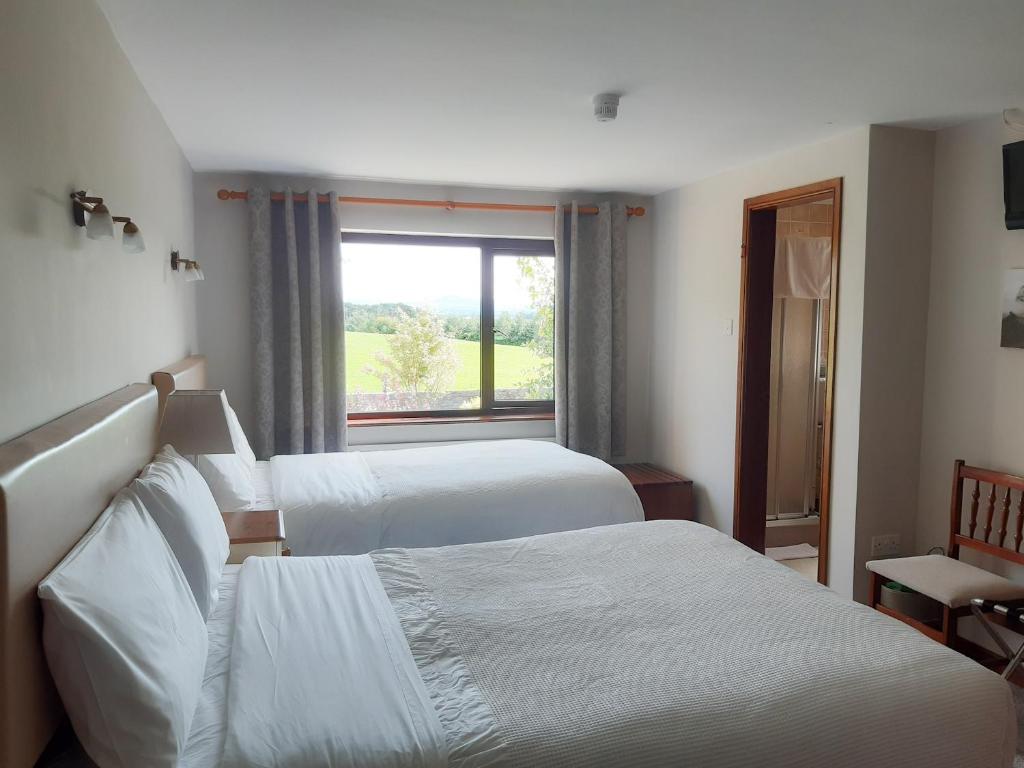 Postel nebo postele na pokoji v ubytování Inveraray Farm