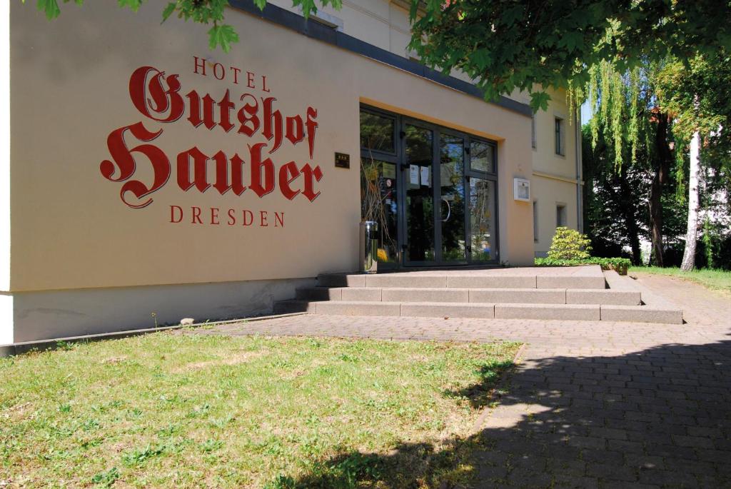a building with a sign that reads hotel superstar summerden at Gutshof Hauber in Dresden