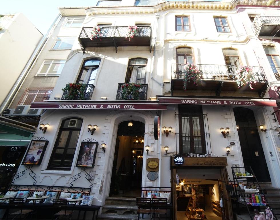 a large white building with a store in front of it at Sarnıç Butik Otel in Istanbul