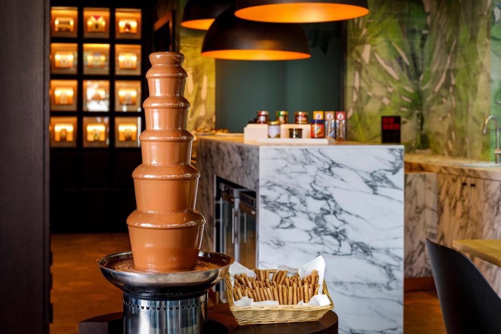 a table topped with a cake next to a fire place at Swiss Chocolate by Fassbind in Zurich