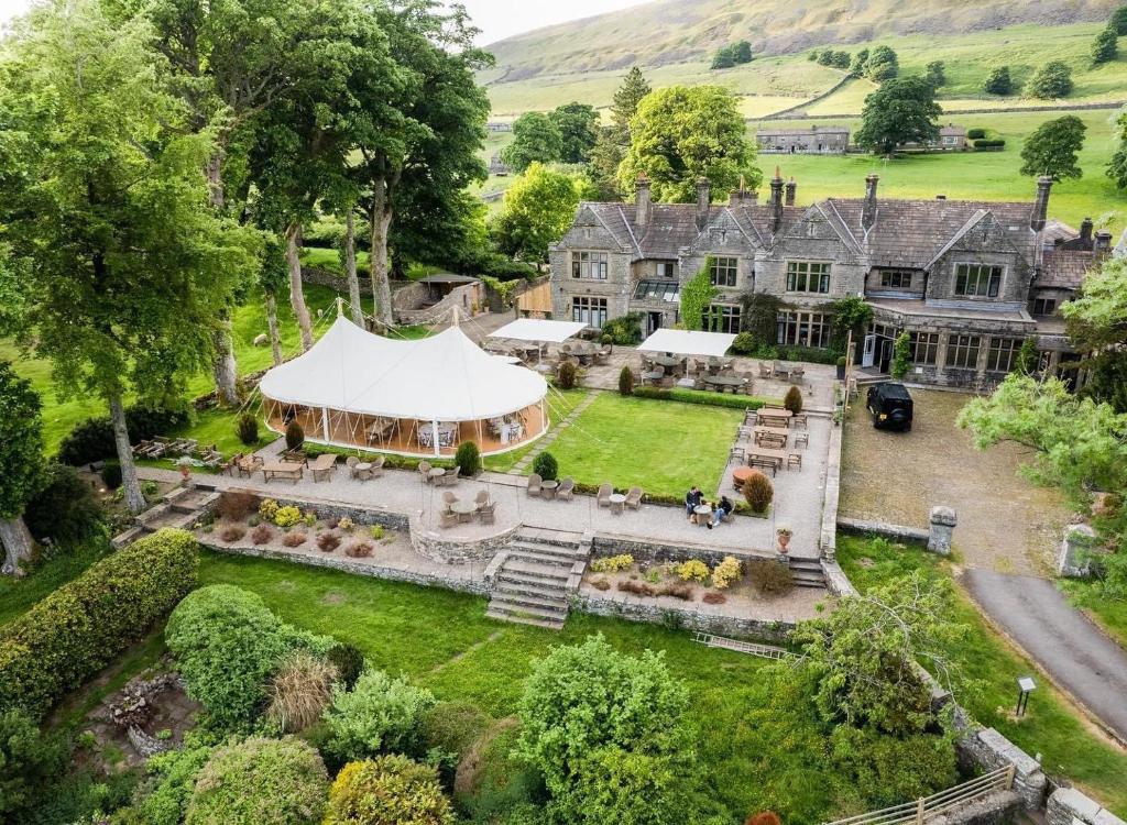 an aerial view of a mansion with a tent at Simonstone Hall Hotel in Hawes