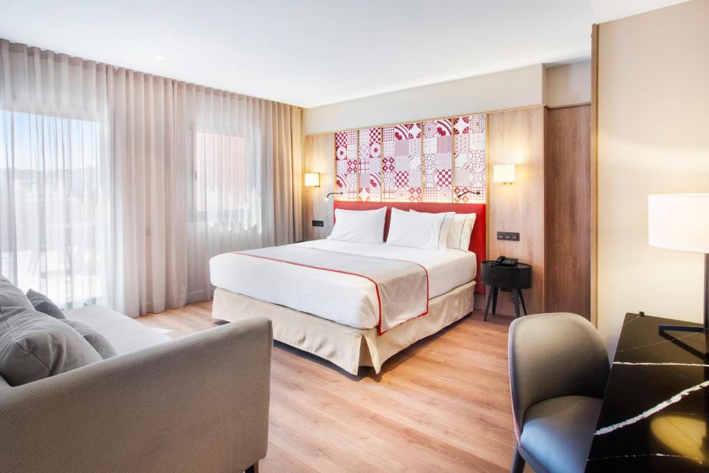 Cama o camas de una habitación en Eurostars Guadalquivir