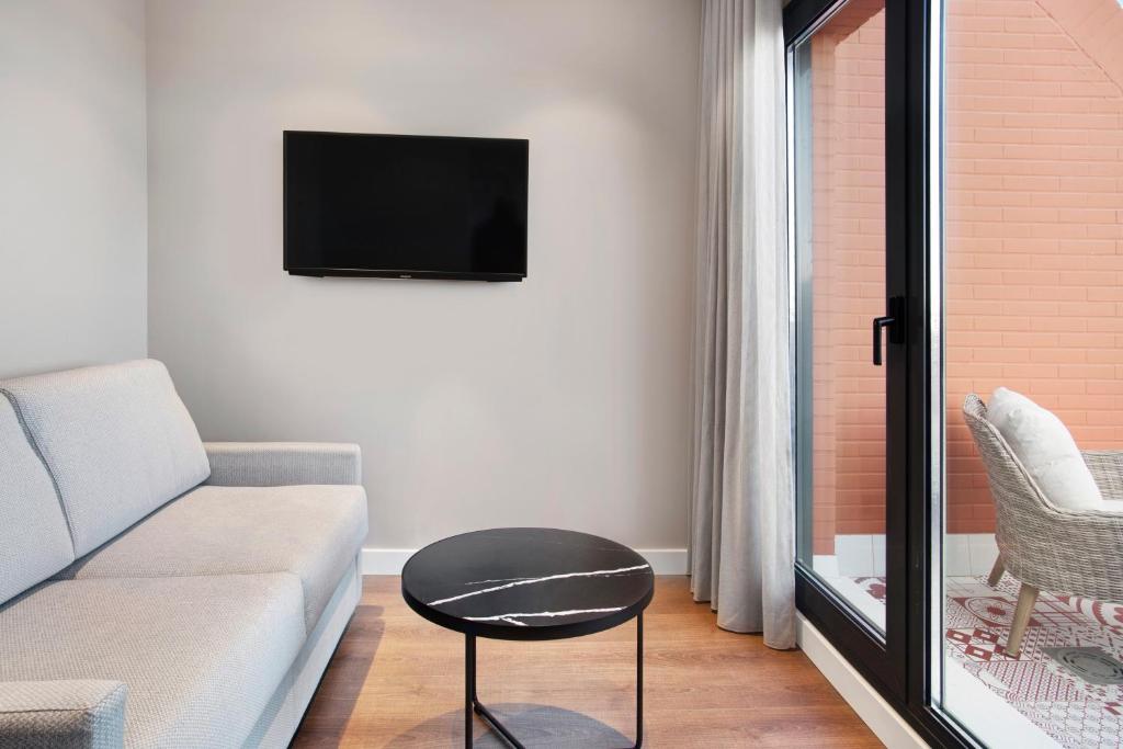 Una televisión o centro de entretenimiento en Eurostars Guadalquivir