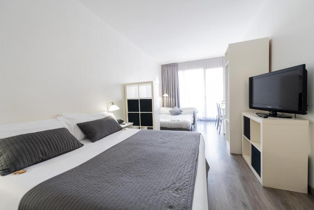 Posteľ alebo postele v izbe v ubytovaní Aparthotel Atenea Calabria