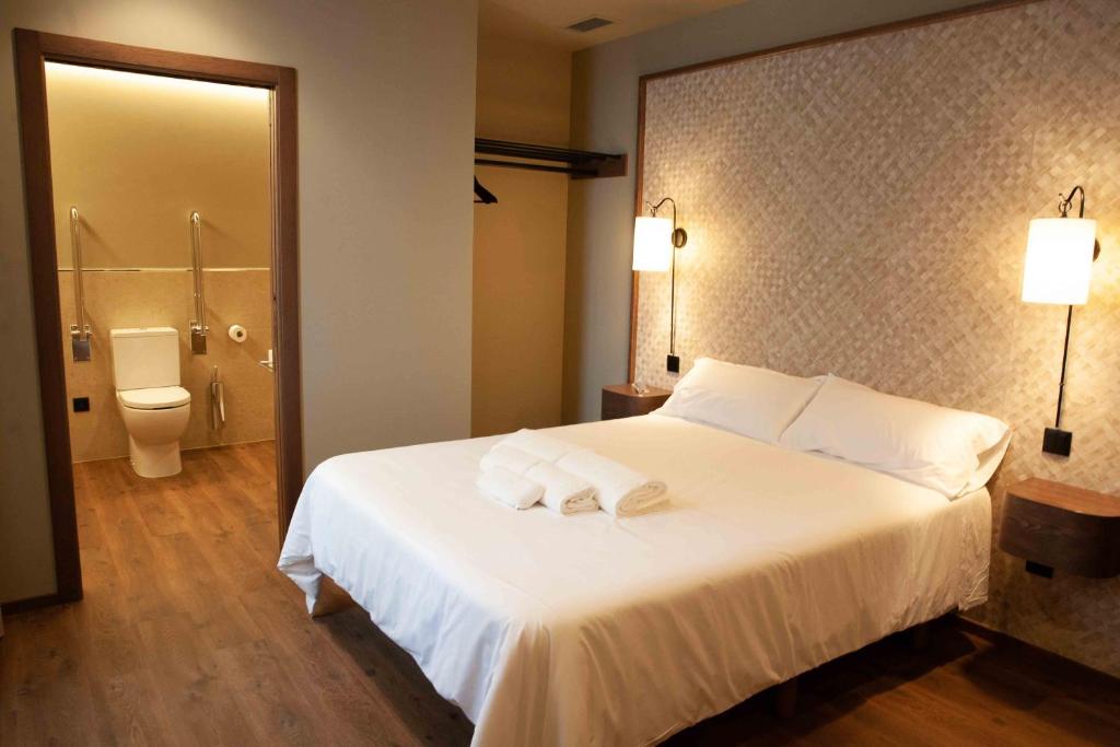 Posteľ alebo postele v izbe v ubytovaní Casa Rico de Medín