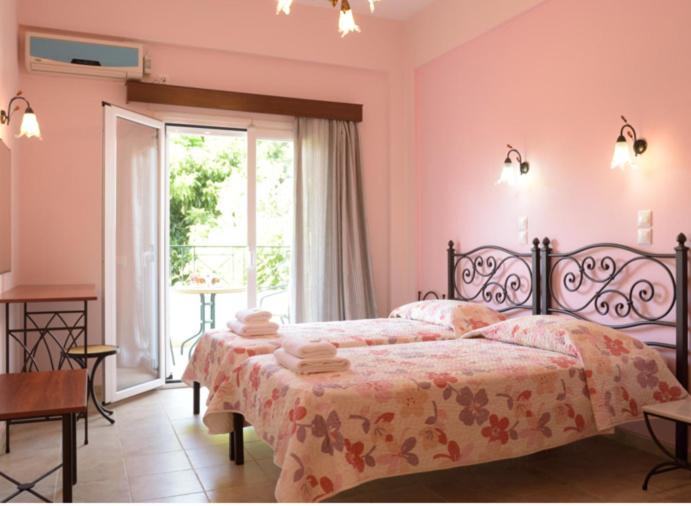 Postel nebo postele na pokoji v ubytování LUISA HOTEL