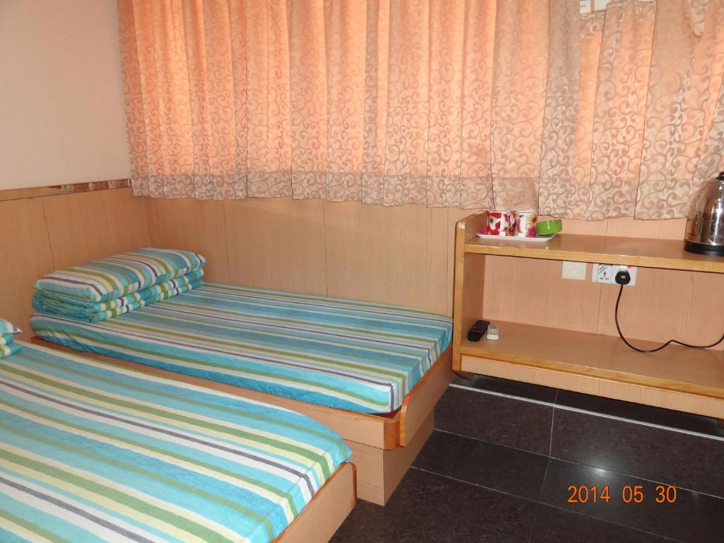 Rúm í herbergi á Fortune Hotel
