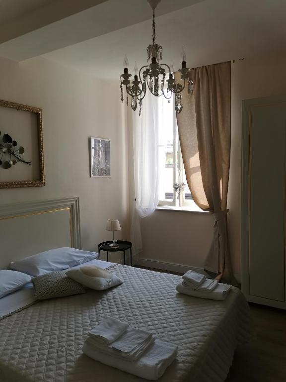 Postel nebo postele na pokoji v ubytování AriediParma - Rooms&apartments