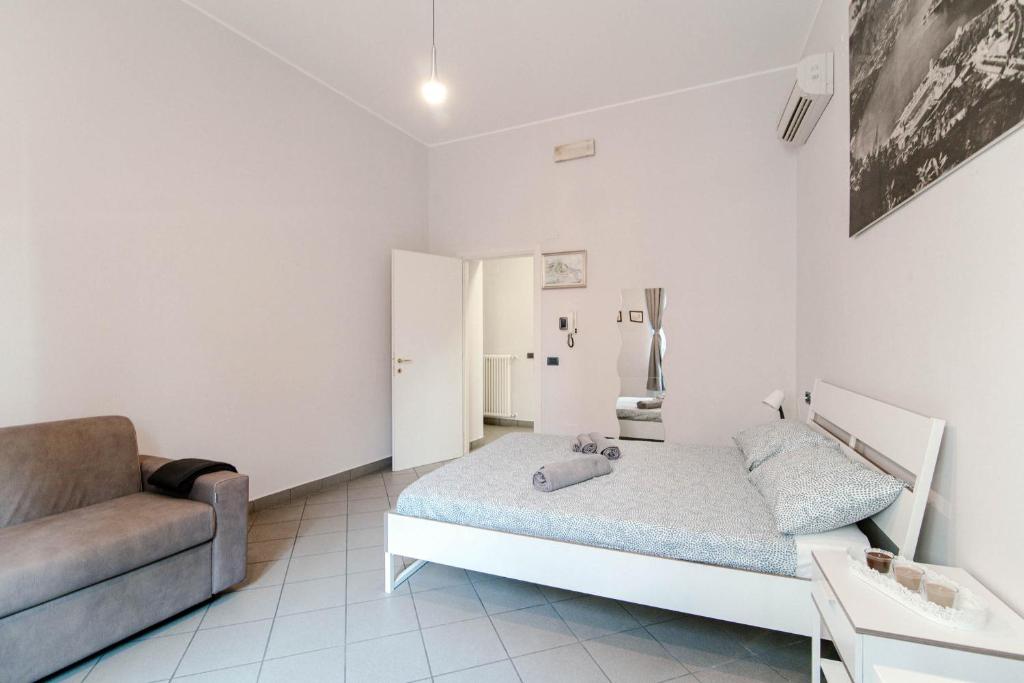 Postel nebo postele na pokoji v ubytování Downtown Rooms