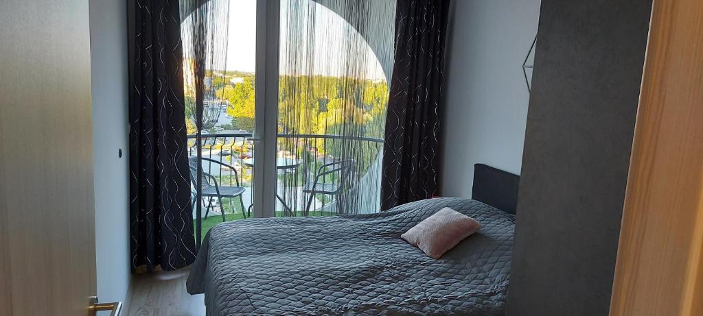 Posteľ alebo postele v izbe v ubytovaní Life Apartmanok