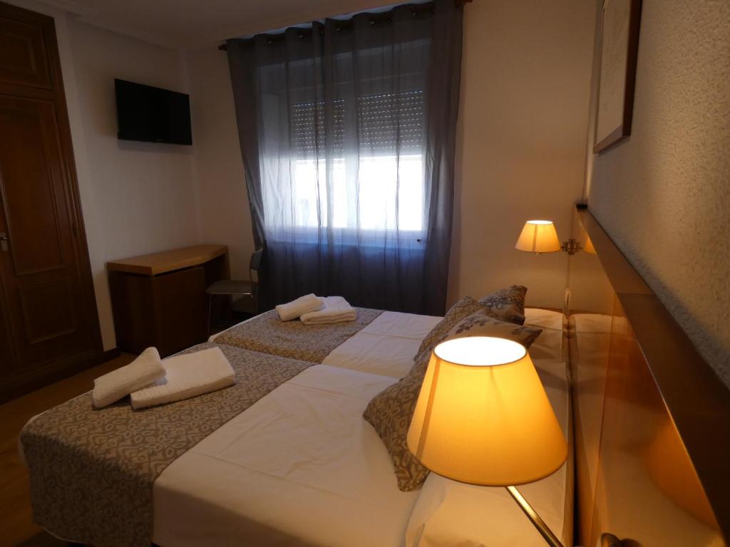 Postel nebo postele na pokoji v ubytování Hotel Mercado by gaiarooms