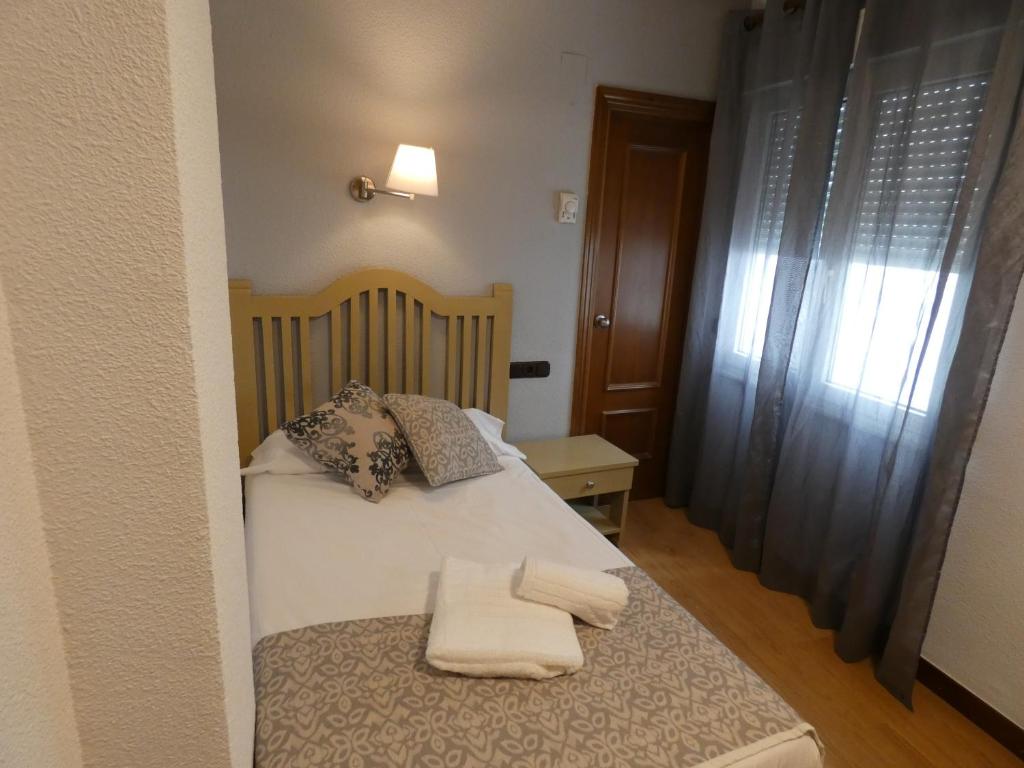 Postel nebo postele na pokoji v ubytování Hotel Mercado by gaiarooms