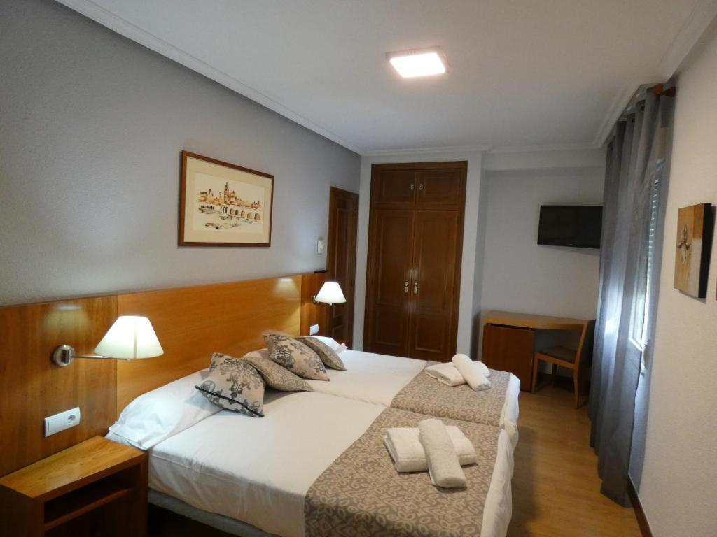 Postel nebo postele na pokoji v ubytování Hotel Mercado by gaiarooms