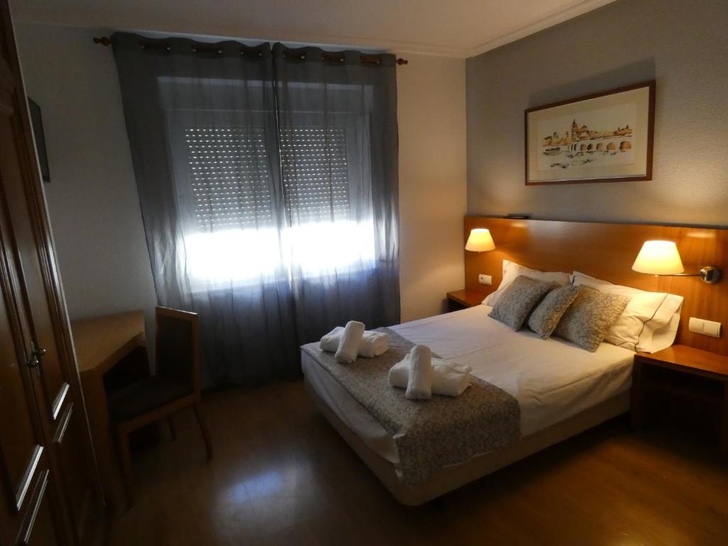 Postel nebo postele na pokoji v ubytování Hotel Mercado by gaiarooms