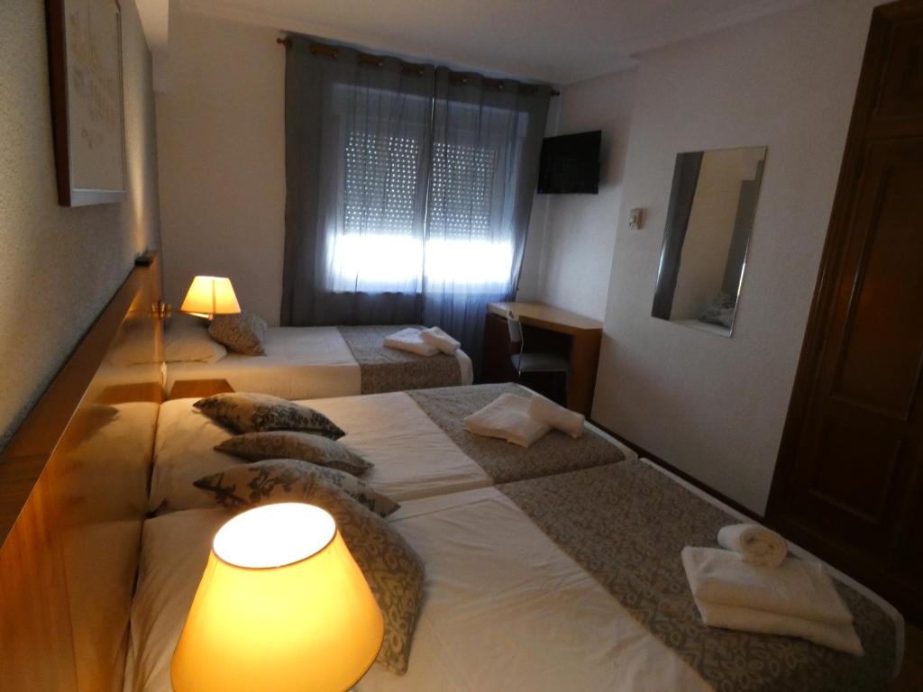 Postel nebo postele na pokoji v ubytování Hotel Mercado by gaiarooms