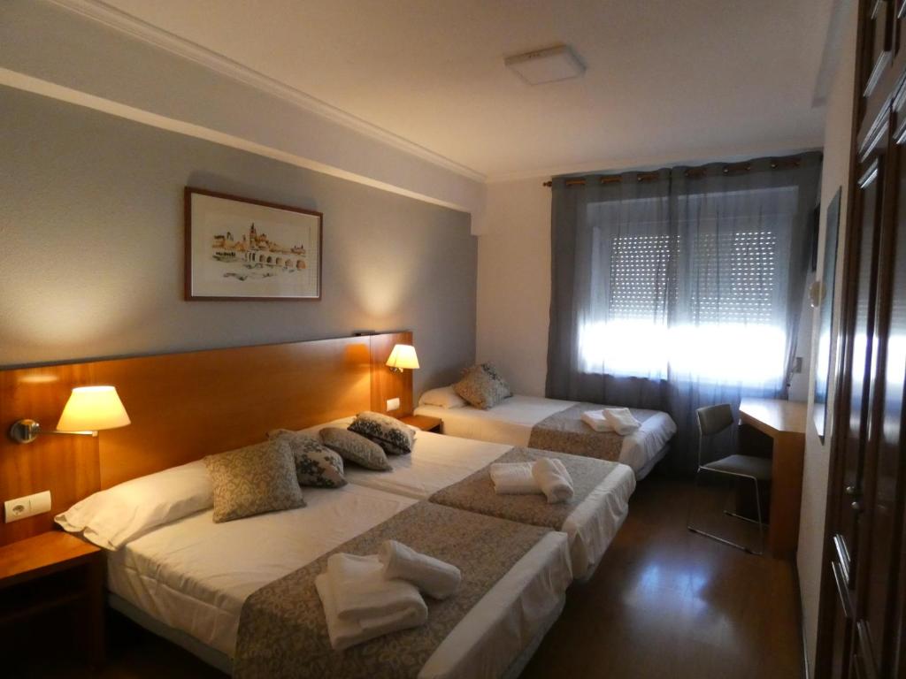 Postel nebo postele na pokoji v ubytování Hotel Mercado by gaiarooms