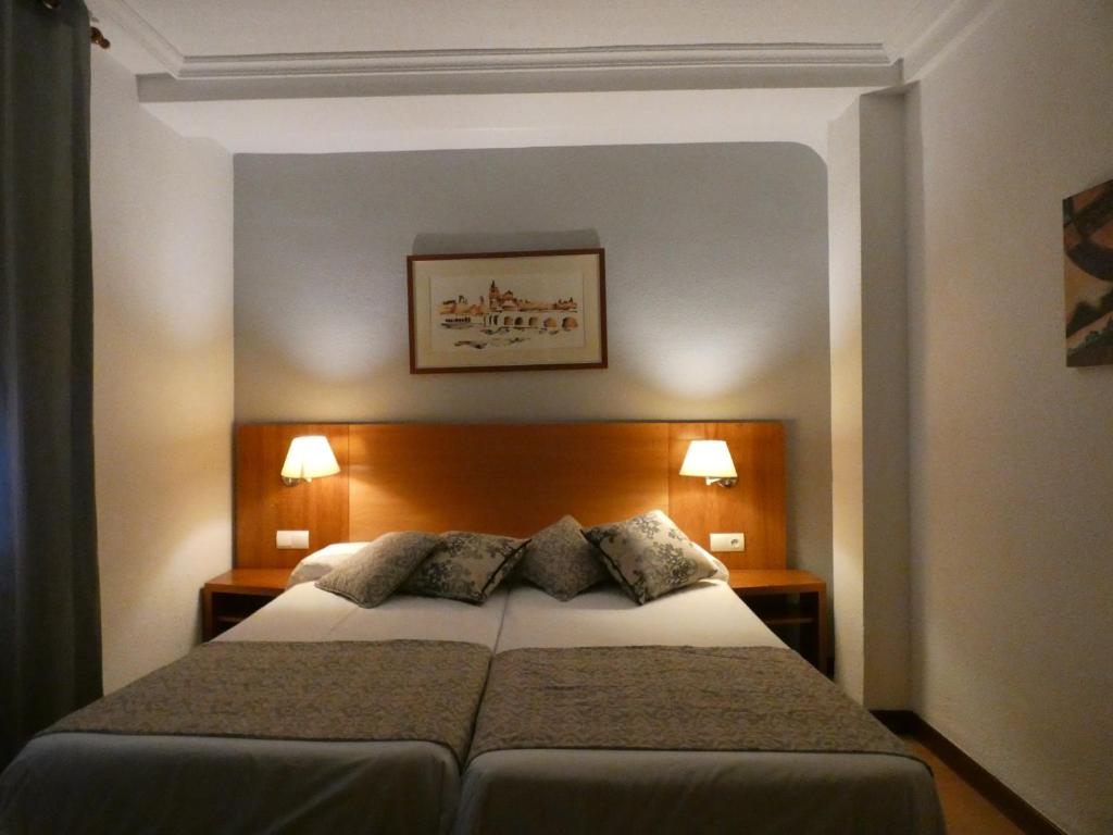 Postel nebo postele na pokoji v ubytování Hotel Mercado by gaiarooms