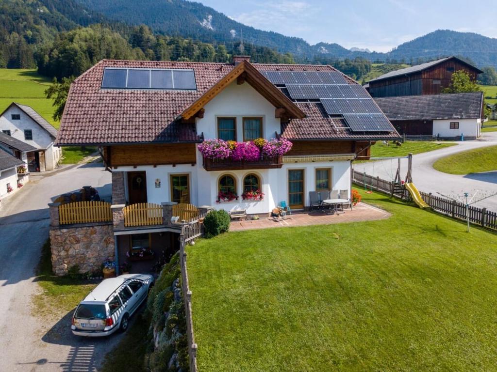 a house with solar panels on the roof at Pernerhof in Aich