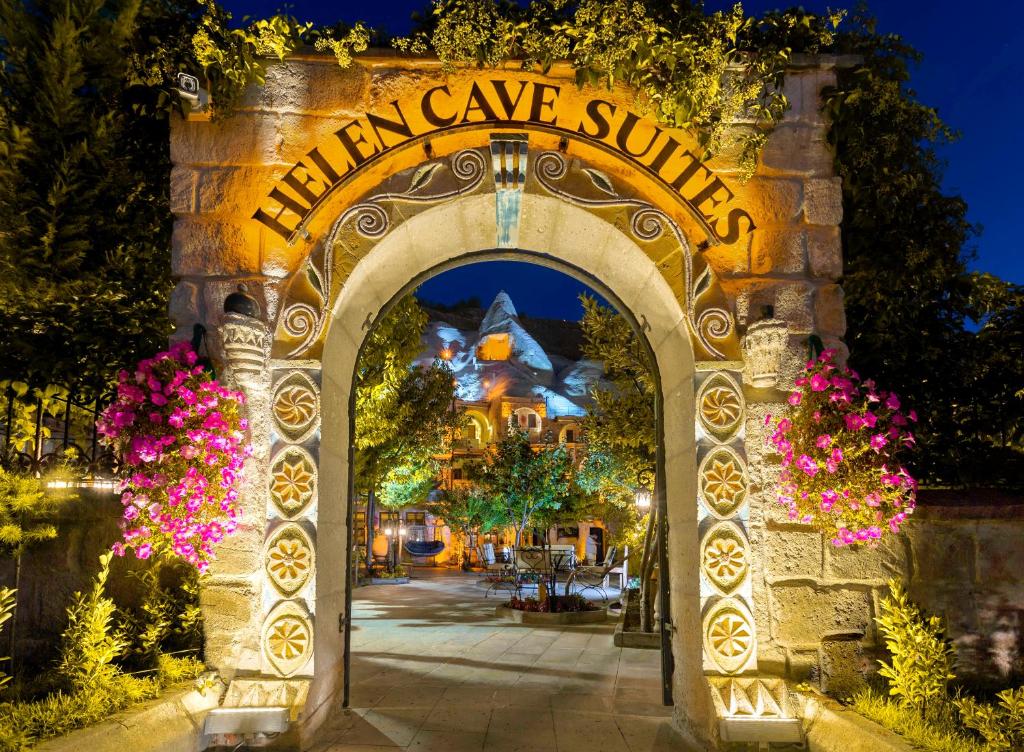 an archway with the entrance to the illuminati cave shrine at night at Helen Cave Suites in Goreme