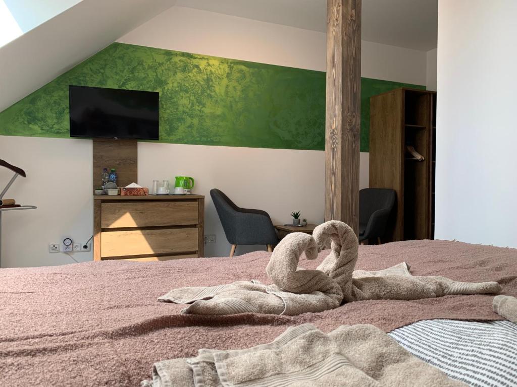 Postel nebo postele na pokoji v ubytování Kamrovec