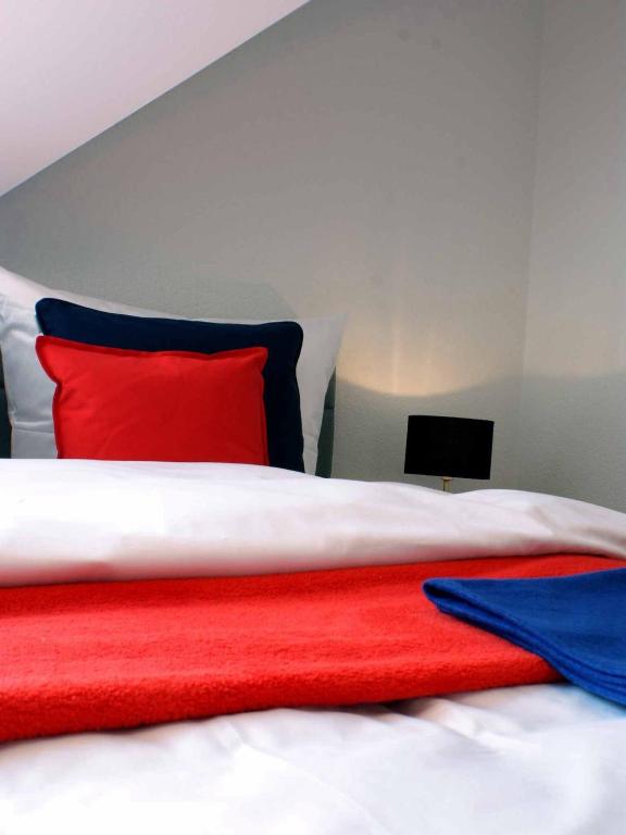 Postel nebo postele na pokoji v ubytování R & J Hotel