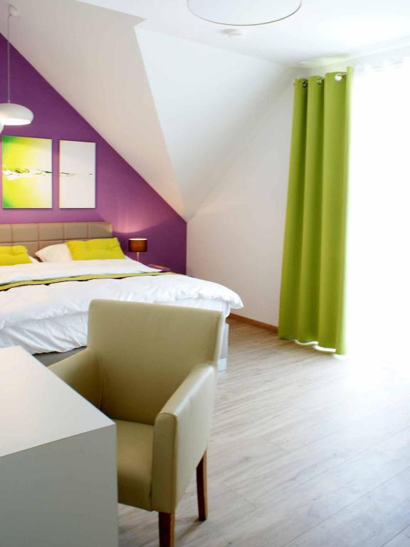 Postel nebo postele na pokoji v ubytování R & J Hotel
