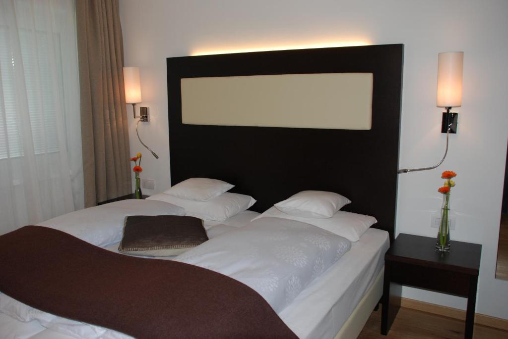 Postel nebo postele na pokoji v ubytování Aparthotel Pichler