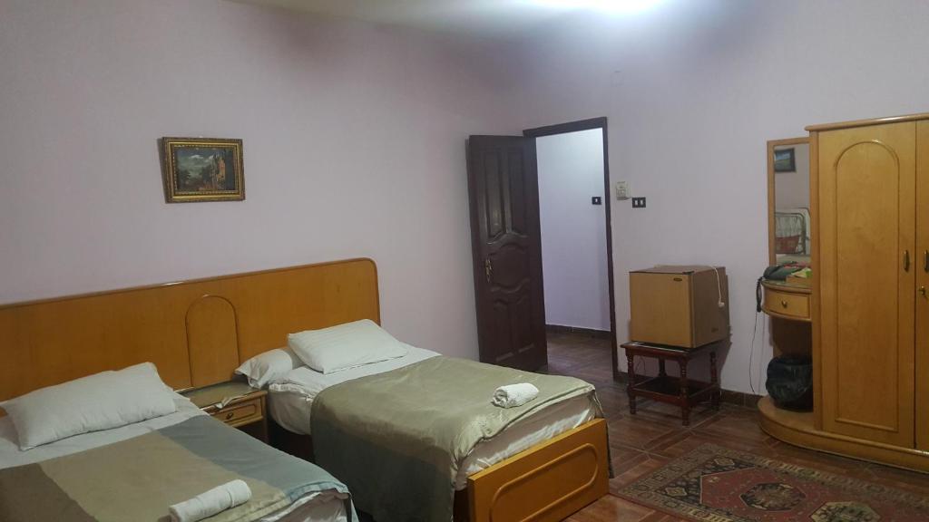 Postel nebo postele na pokoji v ubytování High way Hotel