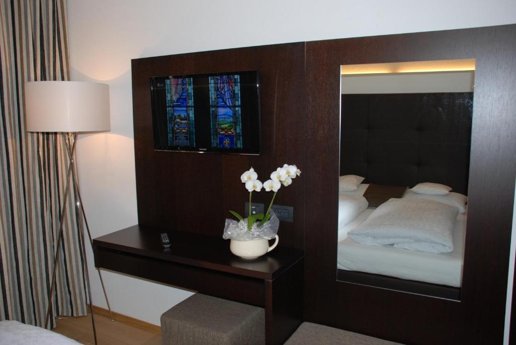 Postel nebo postele na pokoji v ubytování Aparthotel Pichler