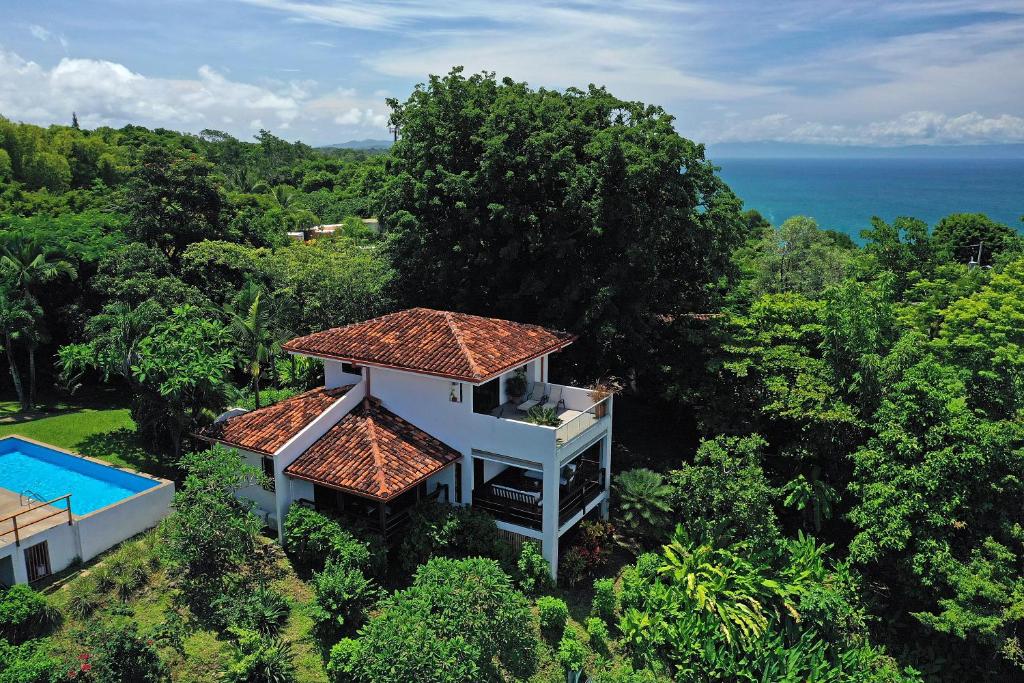 an aerial view of a house with a swimming pool at Casa Frangipani in Montezuma