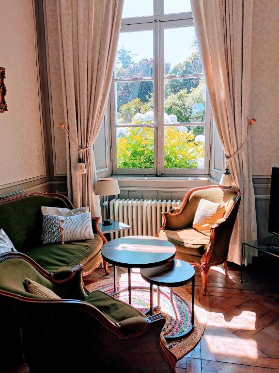 Posezení v ubytování Les chambres d'hôtes du Manoir de Roz-Maria