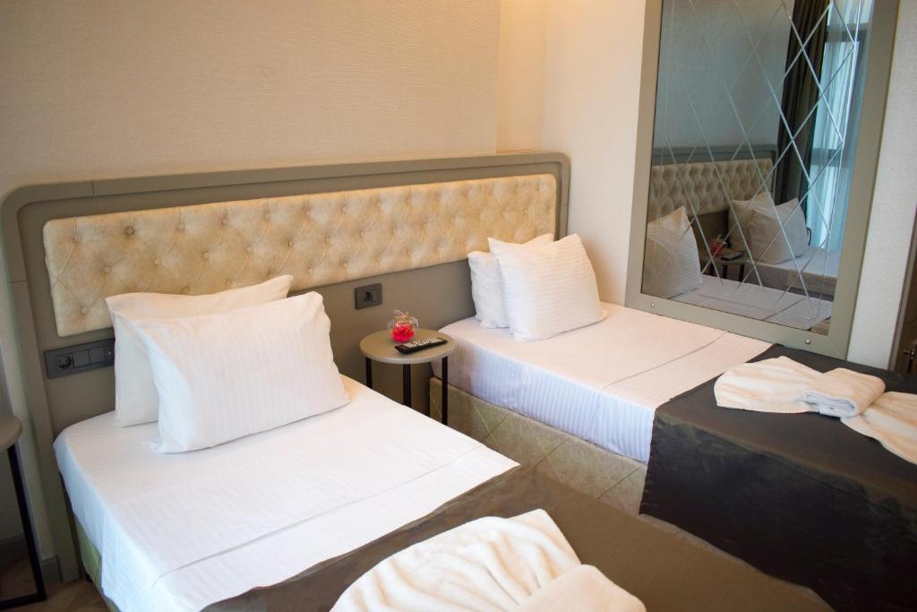Postel nebo postele na pokoji v ubytování Mayer Hotel Istanbul
