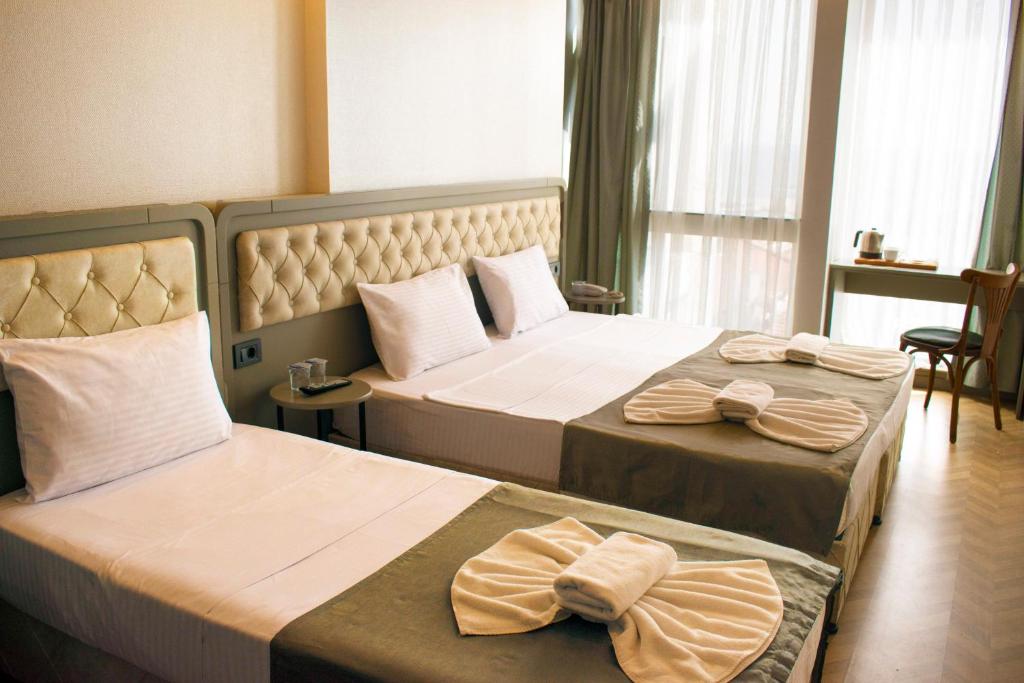 Postel nebo postele na pokoji v ubytování Mayer Hotel Istanbul