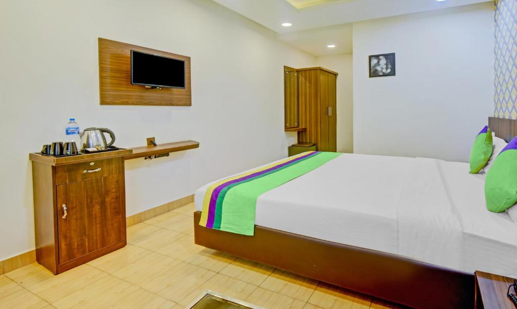 Postel nebo postele na pokoji v ubytování Itsy Hotels Igloo Residency Raja Seat