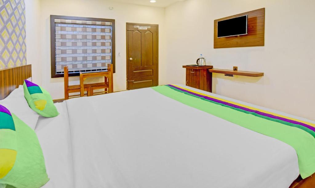 Postel nebo postele na pokoji v ubytování Itsy Hotels Igloo Residency Raja Seat
