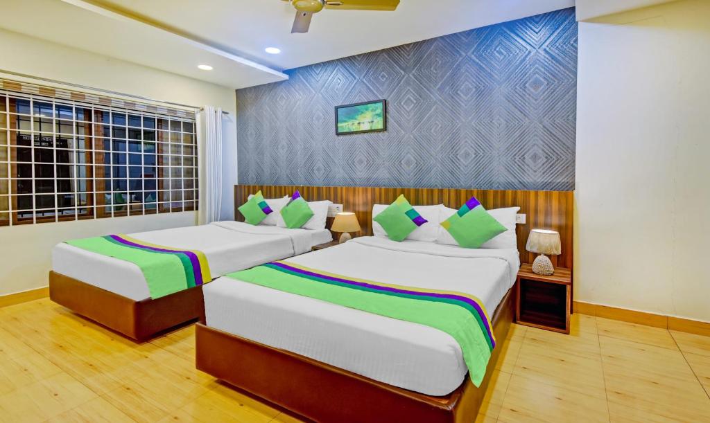 Postel nebo postele na pokoji v ubytování Itsy Hotels Igloo Residency Raja Seat