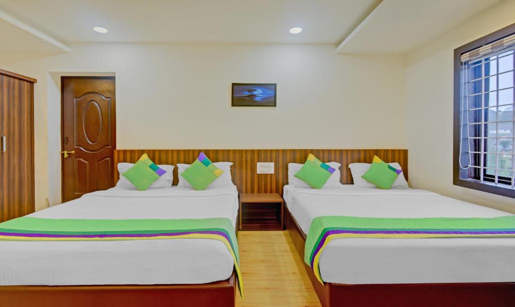 Postel nebo postele na pokoji v ubytování Itsy Hotels Igloo Residency Raja Seat