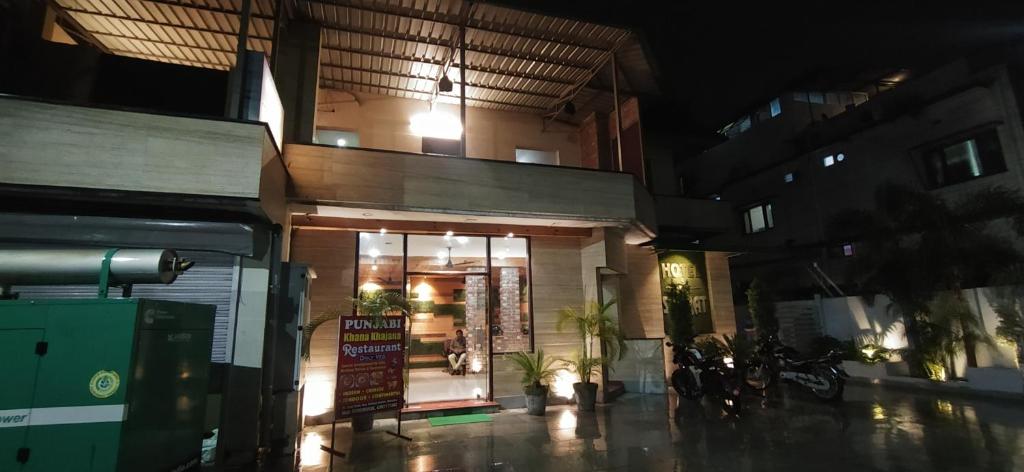 a store front of a building at night at Hotel Samrat in Dehradun
