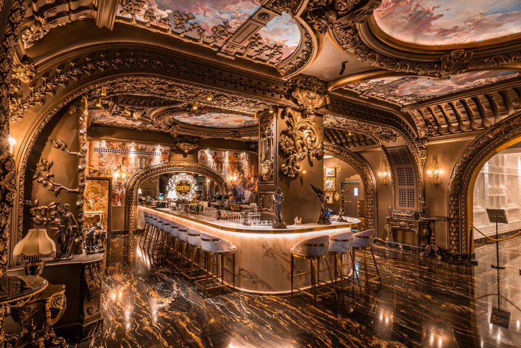 a bar in a room with ornate ceilings at Arte by Thomas Chan in Kuala Lumpur