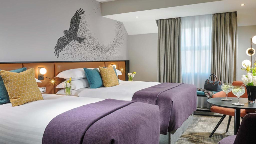 Postel nebo postele na pokoji v ubytování Shannon Springs Hotel