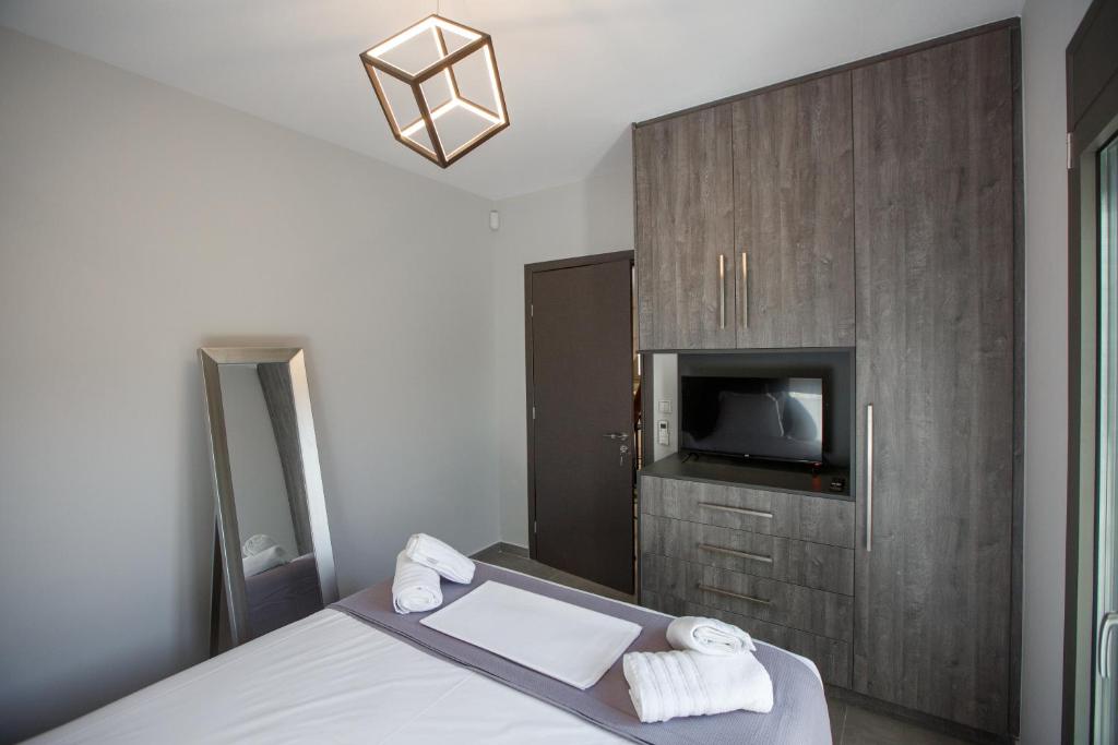 Posteľ alebo postele v izbe v ubytovaní Théa boutique villas sivota II
