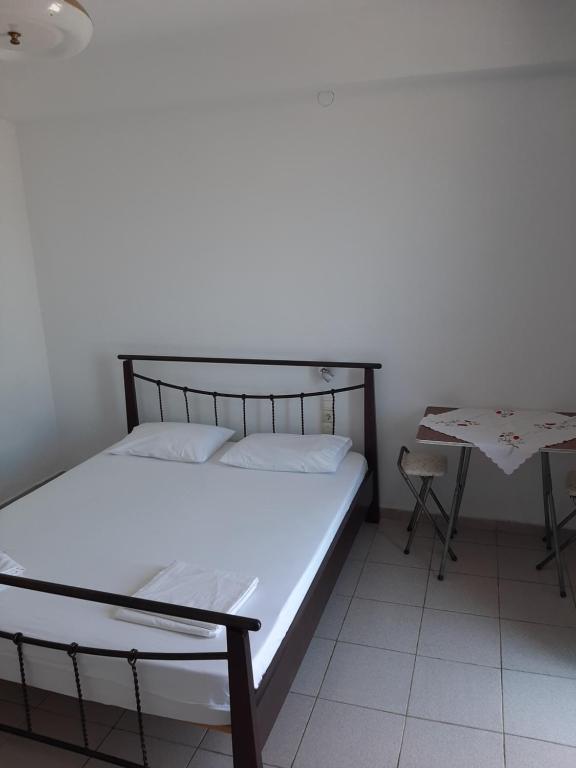 Postel nebo postele na pokoji v ubytování Valentina Rooms