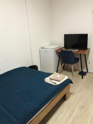 Postel nebo postele na pokoji v ubytování HéberGement du POD