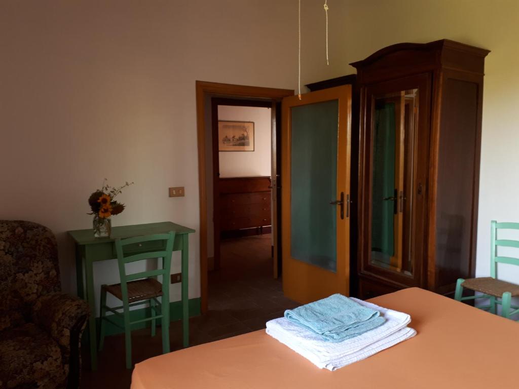 Postel nebo postele na pokoji v ubytování Podere Calcinaia