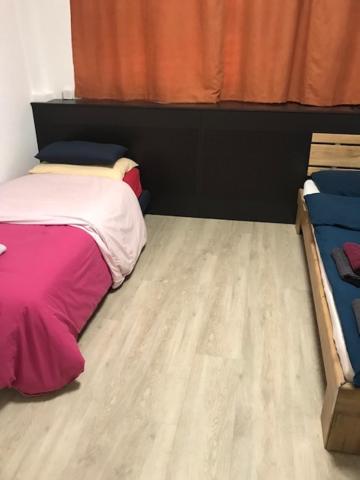 Postel nebo postele na pokoji v ubytování HéberGement du POD