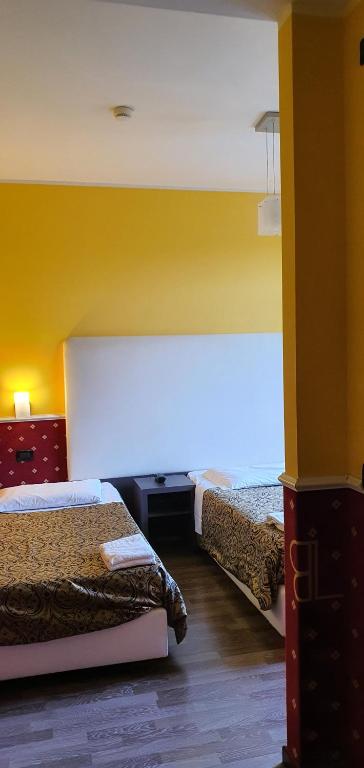 Postel nebo postele na pokoji v ubytování Hotel Laguna Residence