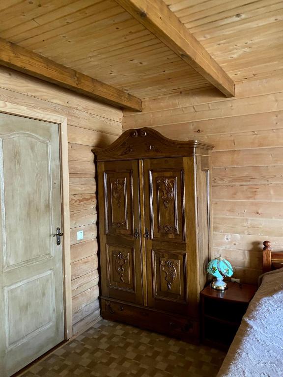 Postel nebo postele na pokoji v ubytování Villa PidStromom